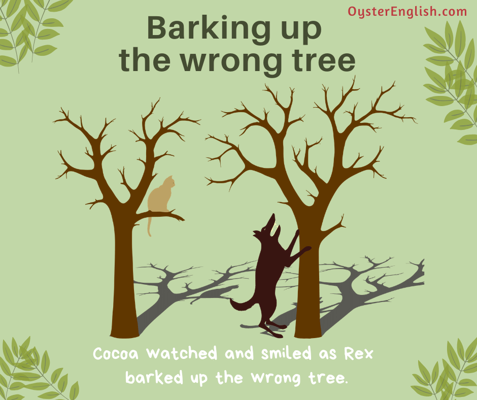 Illustration of a dog standing at tree and barking at it but a cat is sitting in another tree. Caption: Cocoa watched and smiled as Rex barked up the wrong tree.