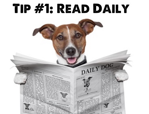 A dog is reading a newspaper (Tip #1: Read daily)