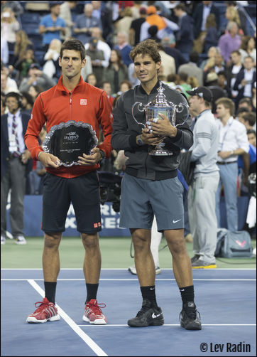 Picture of 2013 US Open tennis finalists, Rafael Nadal (the champion) and Novak Djokovic (runner-up) holding their trophies.